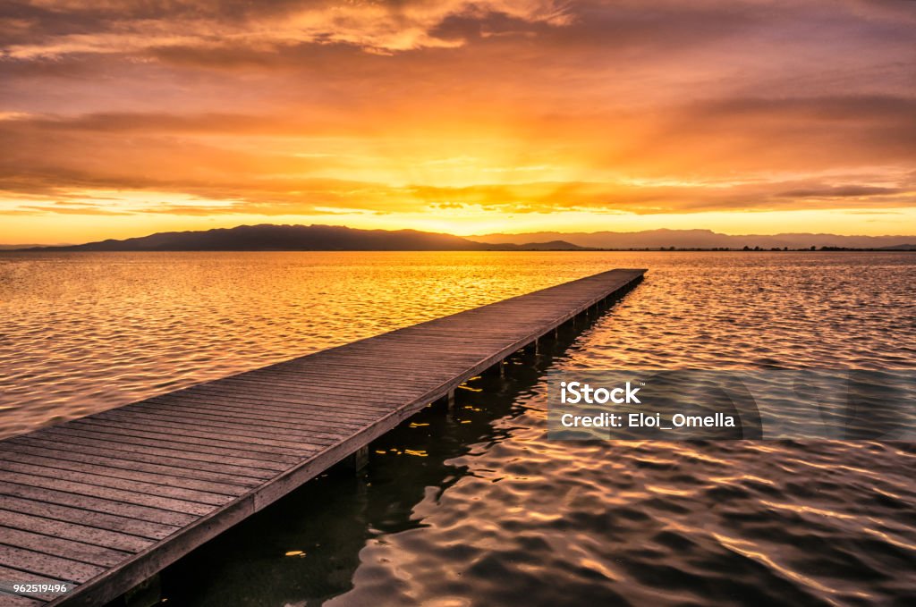sunset in a pier in Delta del Ebro. Spain